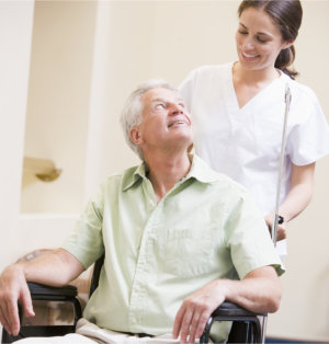 patient smiling at his caregiver